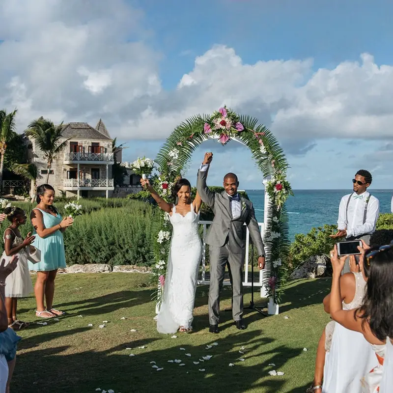 A couple getting married in front of the ocean.