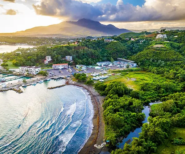 A view of the ocean and mountains from above.