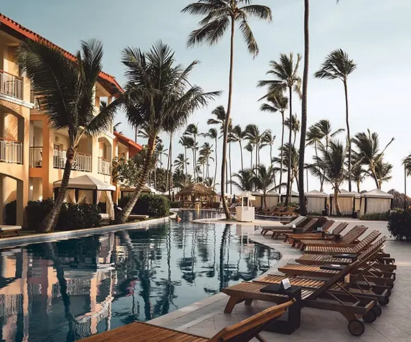 A pool with many chairs in the middle of it