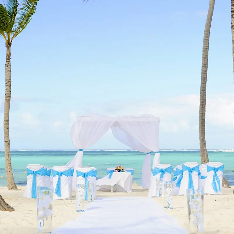 A beach wedding with white and blue decor