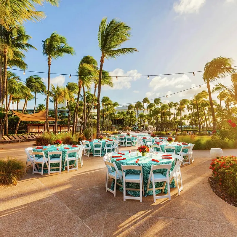 A group of tables and chairs set up for an outdoor event.