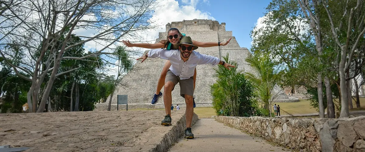 A man and woman are posing for the camera.