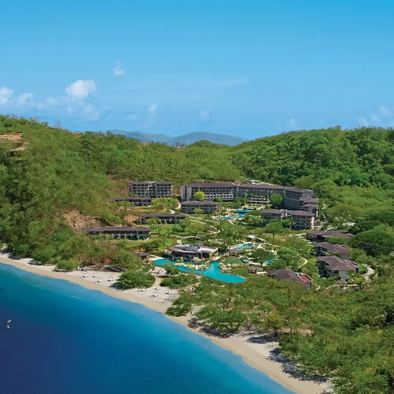 A resort with a pool and a beach.