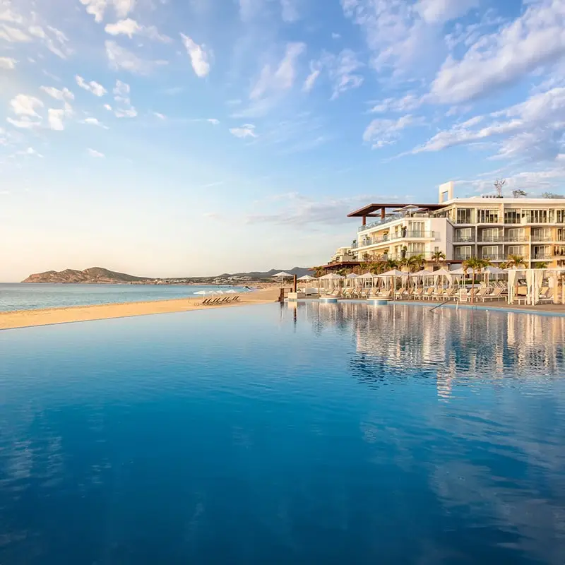 A view of the ocean and beach from across the water.