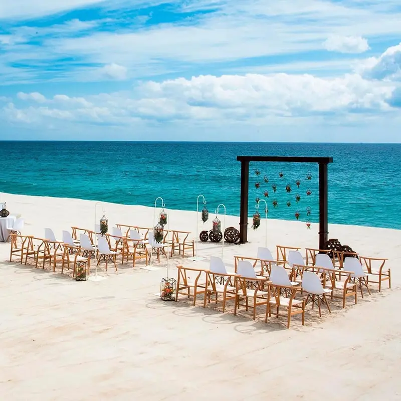 A beach with chairs and tables on it