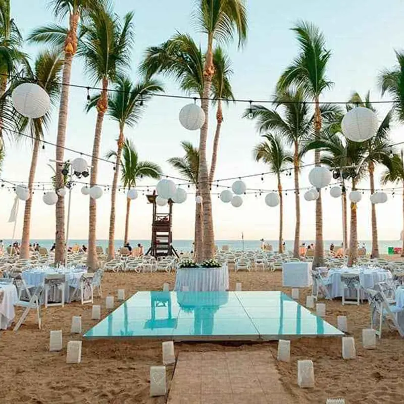 A beach with tables and chairs on it