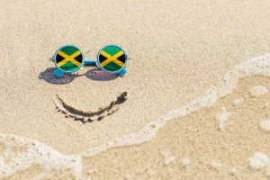 A pair of sunglasses with the jamaican flag on them.