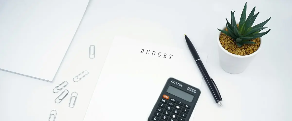 A calculator sitting on top of some papers