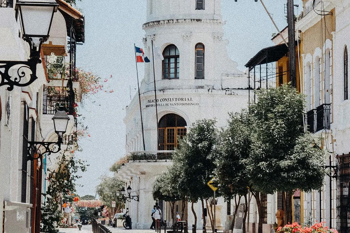 A white building with a tower on top of it.