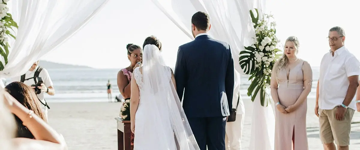 A couple getting married at the beach